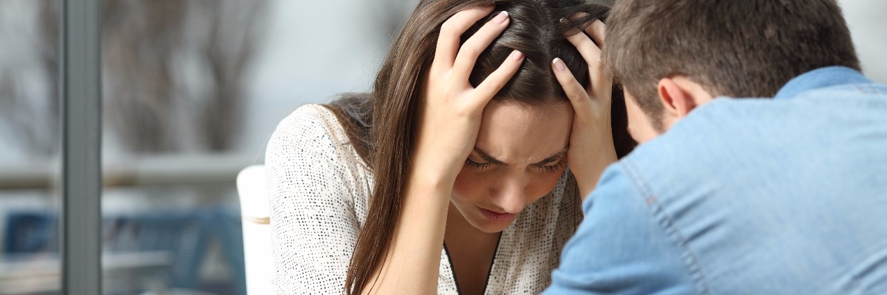 Letter To My Significant Other About What It Means to Have Anxiety man comforting anxious woman in coffee shop