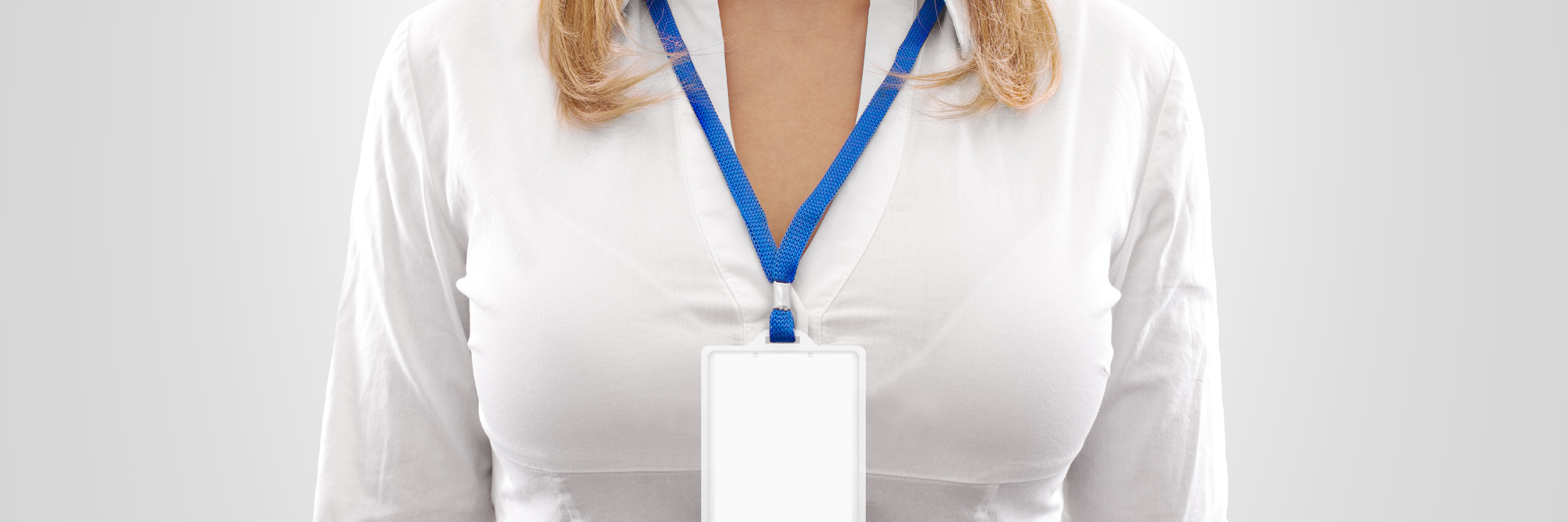 woman wearing a blank id badge around her neck