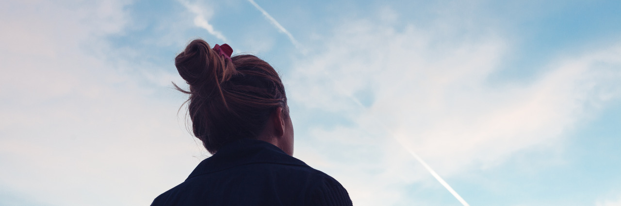 Dyslexia Is Not Just a Reading Disability Silhouette of a young woman looking at sunset.