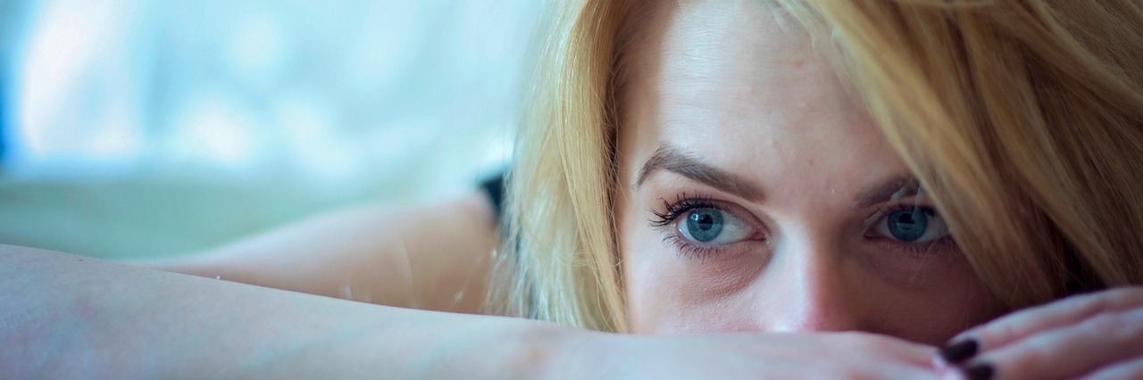 The Reality of Anorexia A woman on her bed