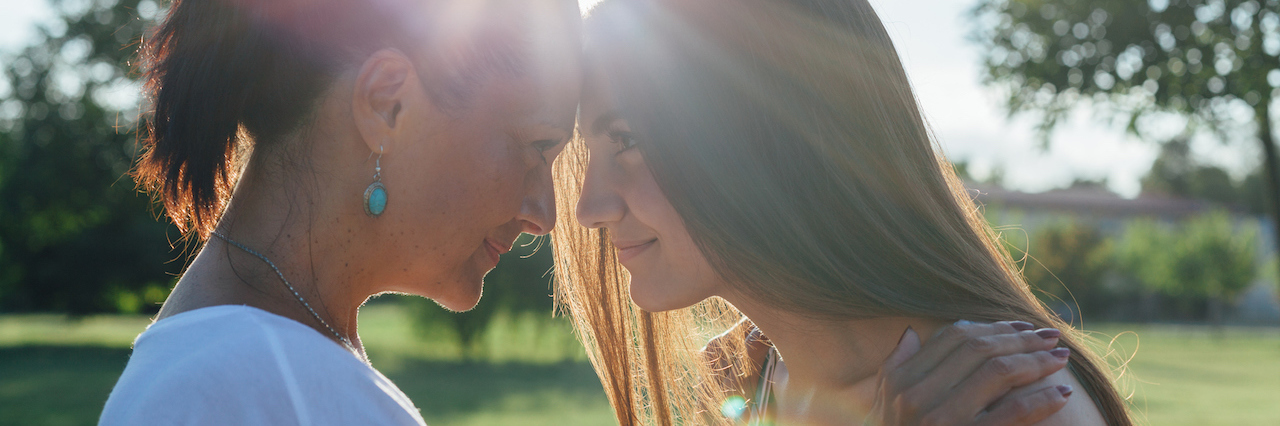 Letter to My Parents From a Young Adult With Multiple Mental Illnesses A mother and daughter embracing outside