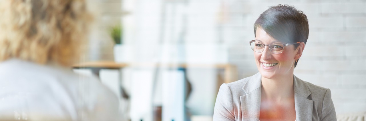 Should I Self-Disclose as a Mental Health Provider? Happy psychologist listening to her patient problem