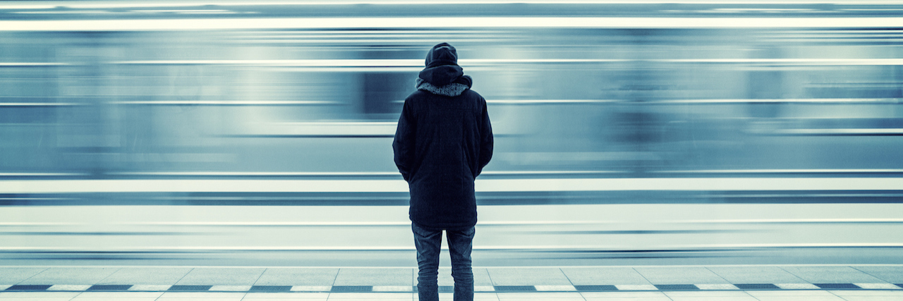 Why I'm Done Waiting for Something to Help My Bipolar A man waiting at the subway station.