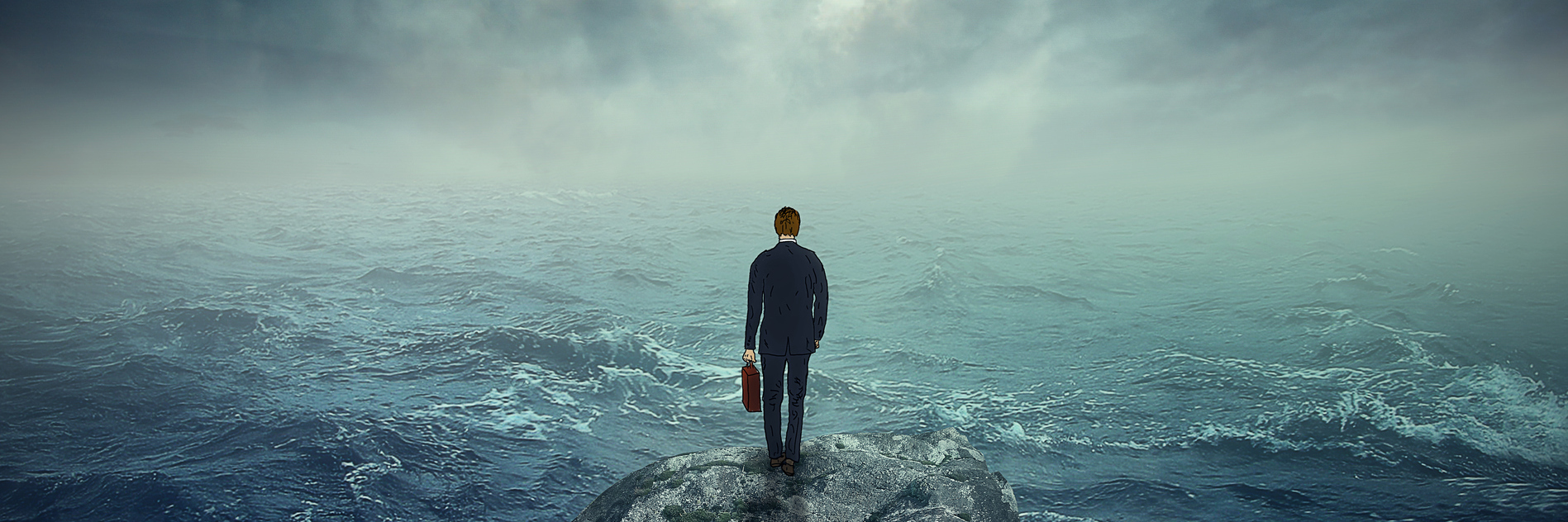 man standing on a rock in the middle of a stormy sea