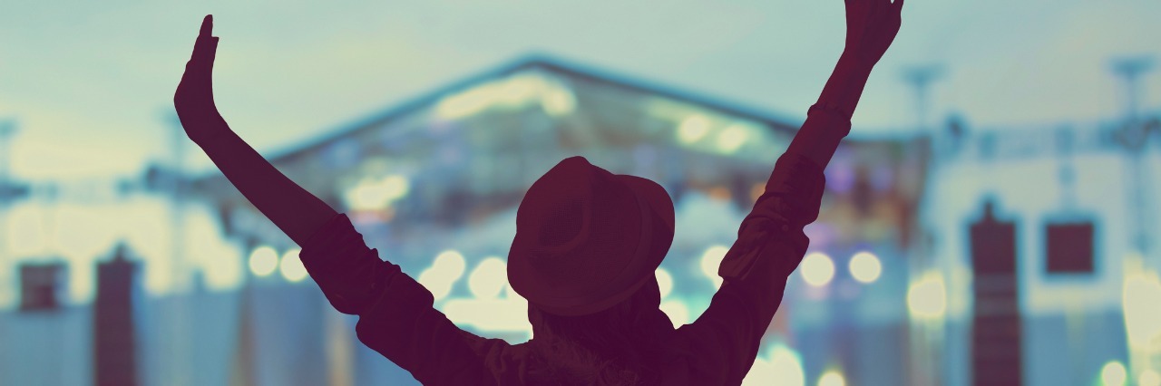 4 Tips for Being Adventurous With a Primary Immunodeficiency Disorder Woman enjoying a concert.