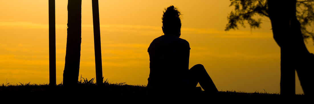 This Summer, Depression Won't Win Again Woman sitting alone on sunset and listening music.