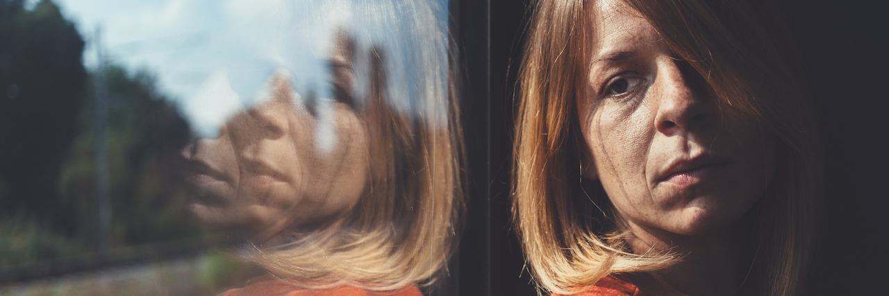 The Connection Between Diabetes and Depression A woman in train alone and sad