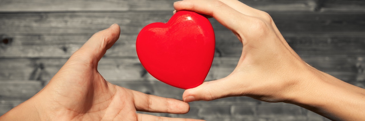 Lyme Disease: Getting the Love and Support You Deserve two hands exchanging a red heart