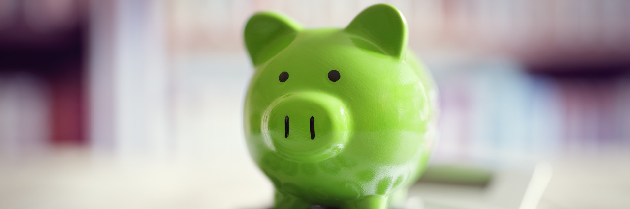 ABLE Accounts Allow Savings Without Losing Social Security Benefits Piggy bank with calculator.