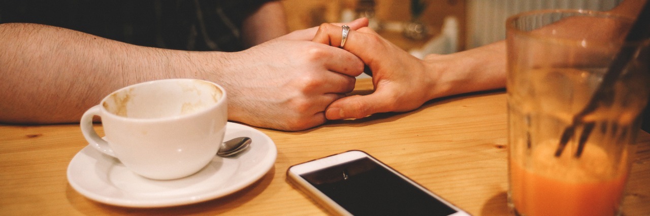 Why I Wouldn't Be Here Without My Friends and Loved Ones man and woman holding hands in coffee shop