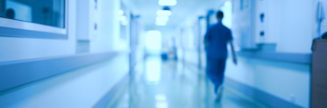 Hospital corridor and doctor as a blurred defocused background