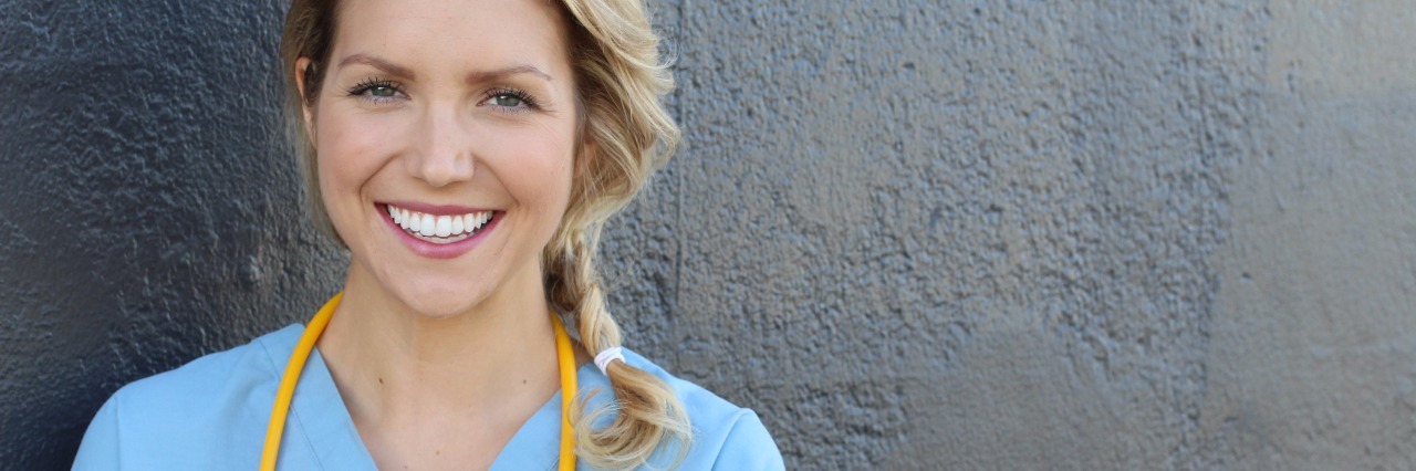 nurse smiling with stethoscope around her neck