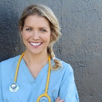 nurse smiling with stethoscope around her neck