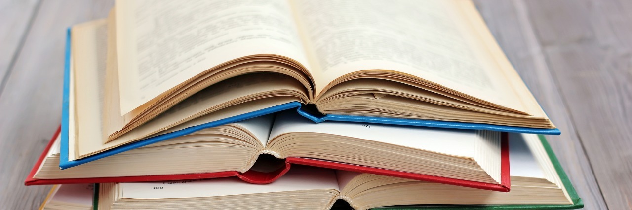 Quotes to Help Cope With Chronic Pain stack of opened books