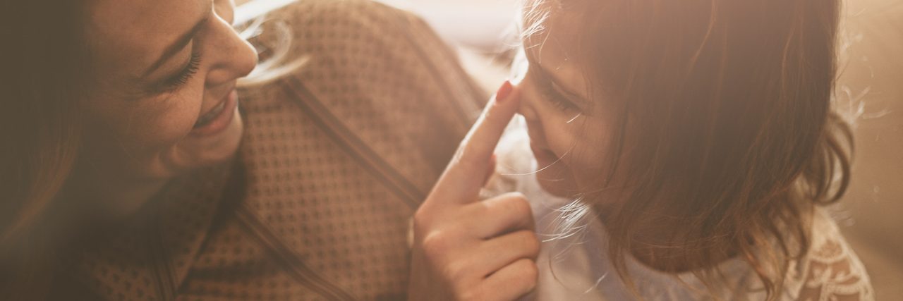 25 Secrets of Moms With Mental Illness Mother touching daughter's nose.