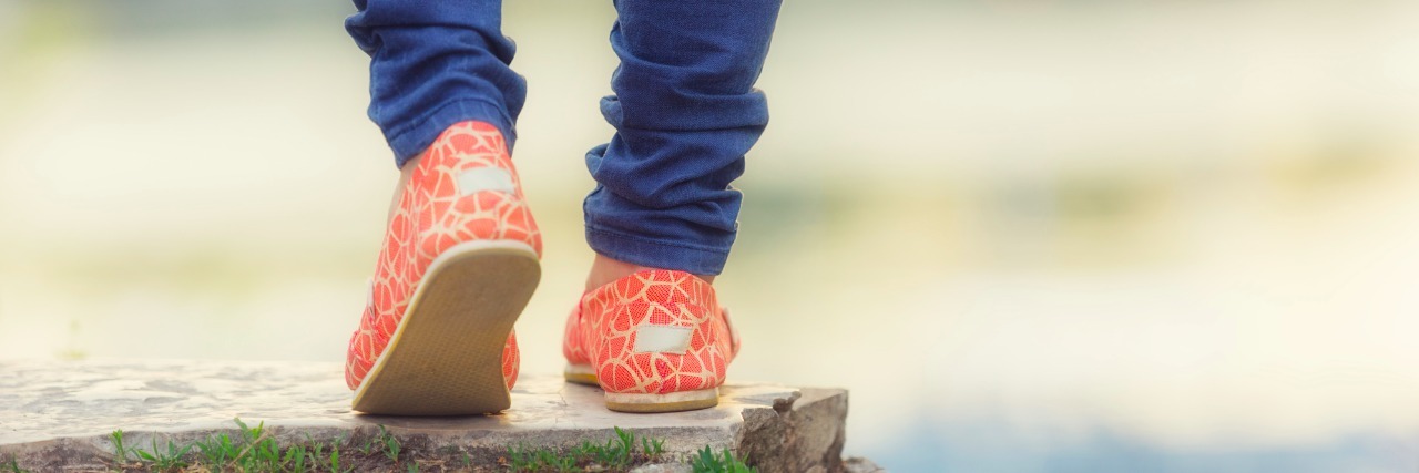 What I Should Have Told the Man Who Made Fun of My Walk legs and shoes of woman walking outside