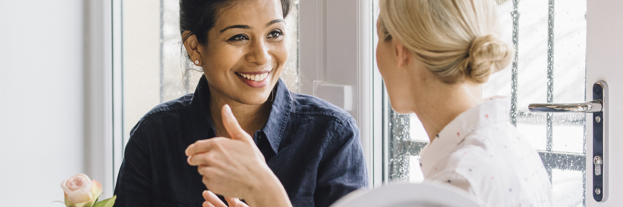 What to Know About Your Friend With Fibromyalgia two friends talking over tea in a cafe