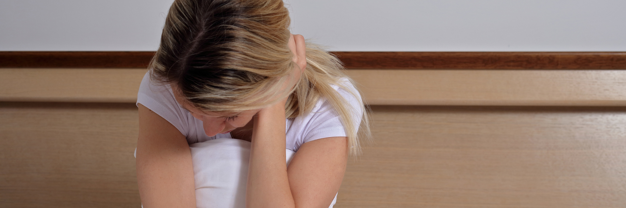 Borderline Personality Disorder Affected by a Text Message woman in bed upset and tired with hand in hair