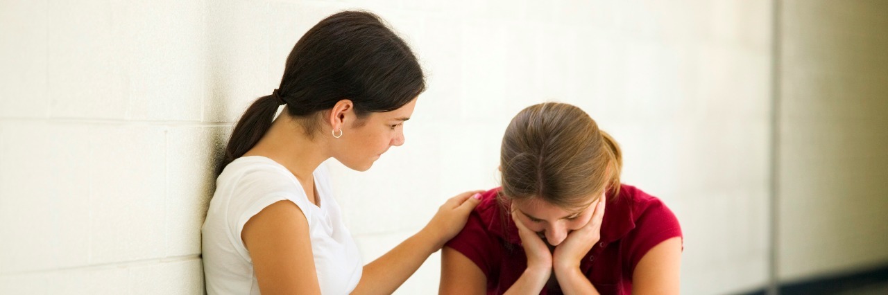 When Your Best Friend Has Depression Too two women sad in hallway