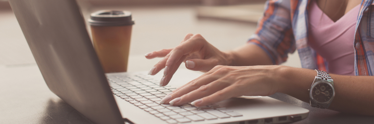 What It's Like to Be a Writer With Bipolar Disorder hands typing on keyboard