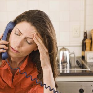 Distresses woman on the phone.