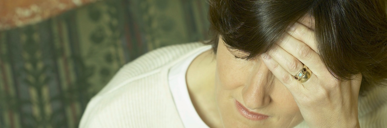 Why Having Autoimmune Disease Is Stressful stressed woman with hand on head
