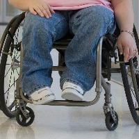 Disabled woman sitting in a wheelchair.