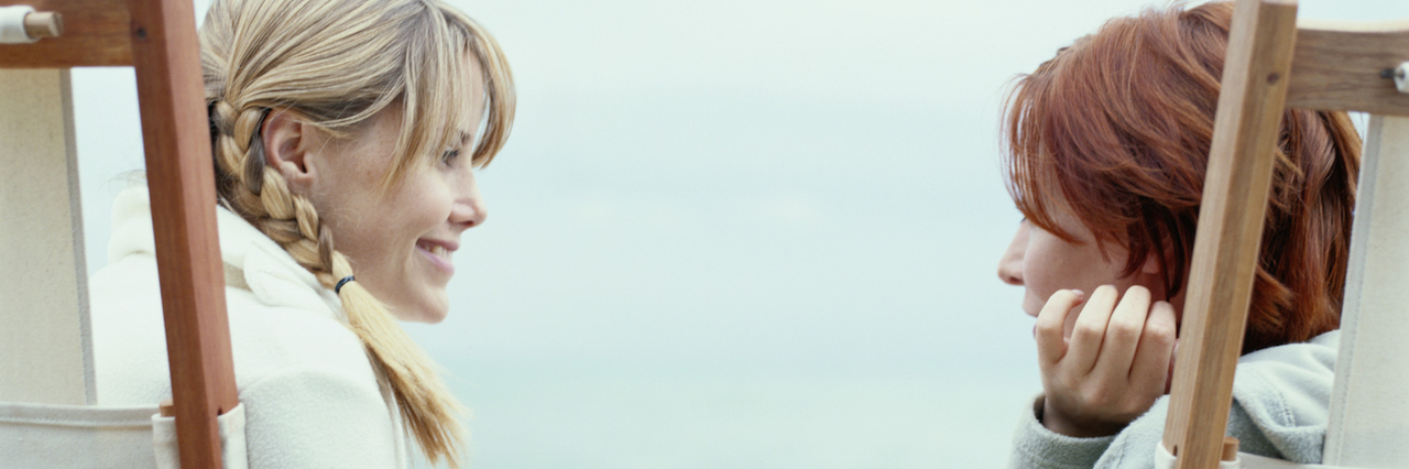 To the People Who Support Me With My Bipolar Disorder Two woman talking to each other, sitting on beach chairs