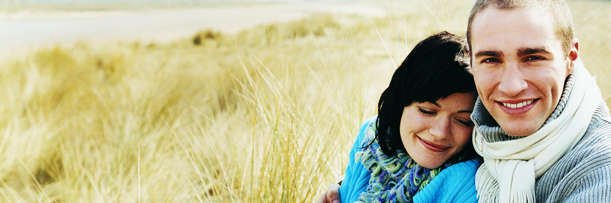 A Letter to My Future Husband About My Mental Illness A couple, sitting on a beach