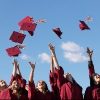 graduates throwing their caps in the air