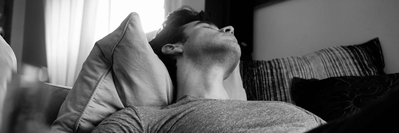 Things I Didn't Realize Would Affect My Post-Traumatic Stress Disorder black and white photo of man laying in bed