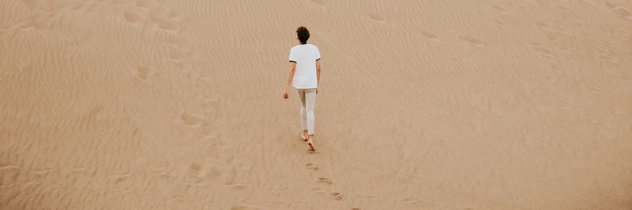 When You Feel Lost Because of Your Mental Illness Diagnosis person walking on sand dune