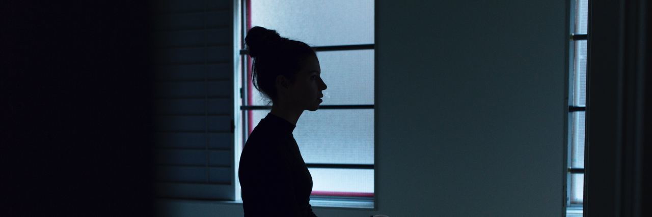 When Mental Health Professionals Overlook the Difficulties of Recovery a woman sits on the side of her bed in early morning