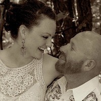 husband and wife hugging and laughing with each other