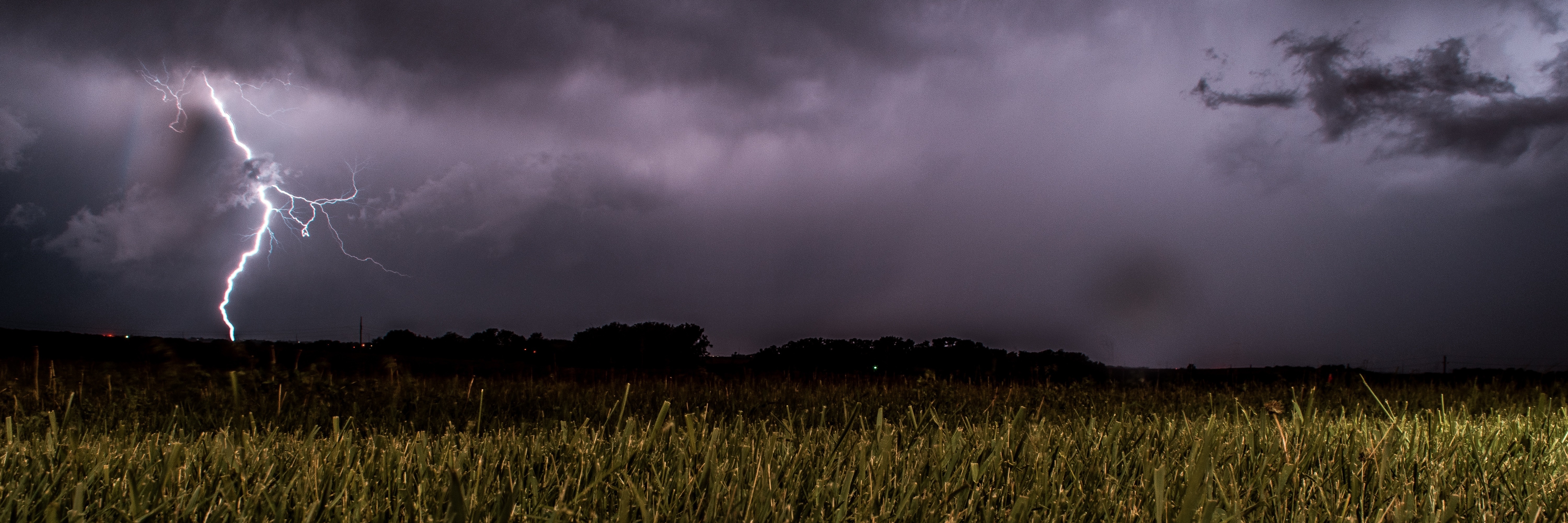 storm and lightning over fields
