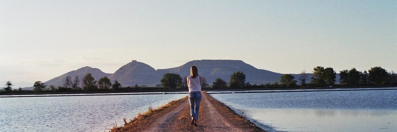 The Path of the Survivor woman on single path