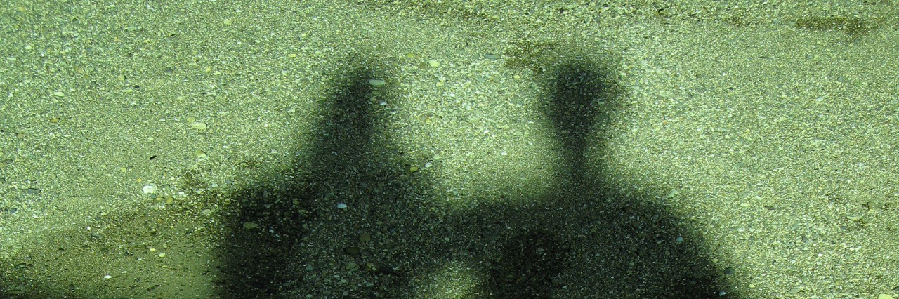 When Depression and Loneliness Are Always With You shadows in green light standing side by side