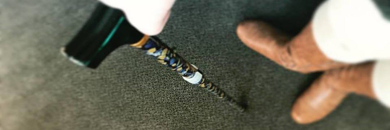 How Using a Cane Has Been Helpful With Myasthenia Gravis woman walking with a floral cane