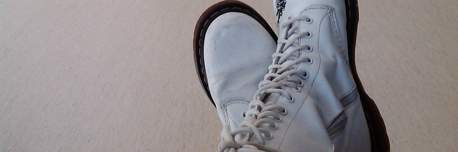 Fighting Chronic Fatigue While in Remission From Crohn's Disease image of woman's shoes as she sits down in a hallway