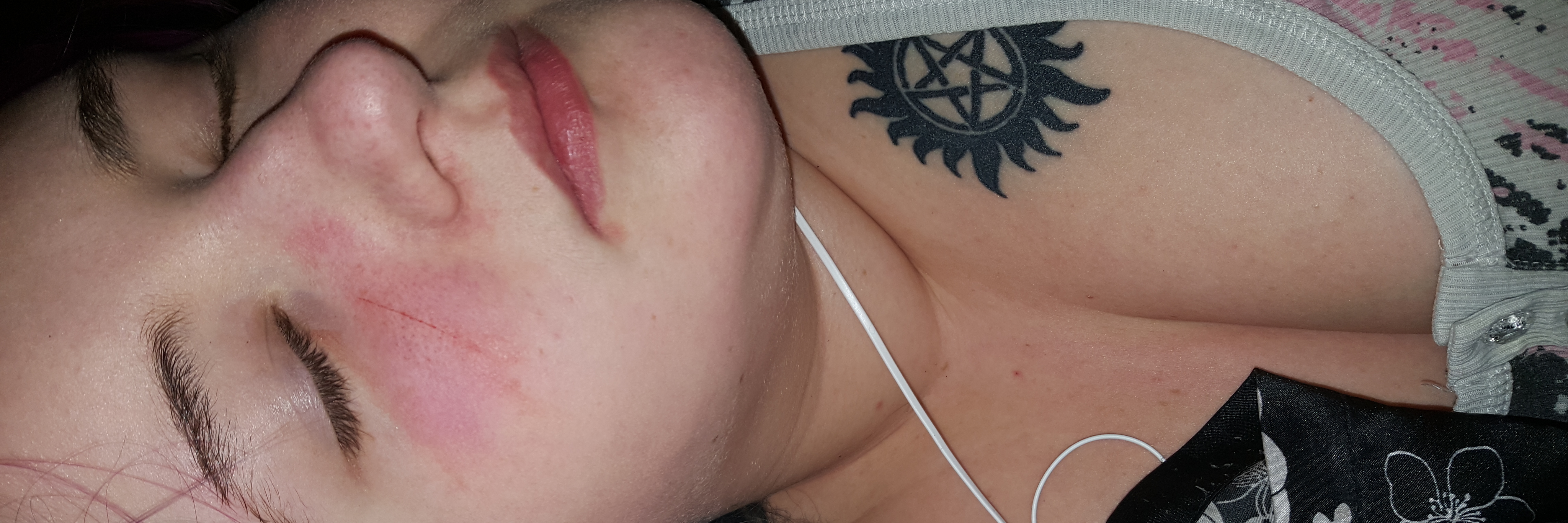 What It's Like to Have a Seizure woman lying down with her eyes closed after a seizure