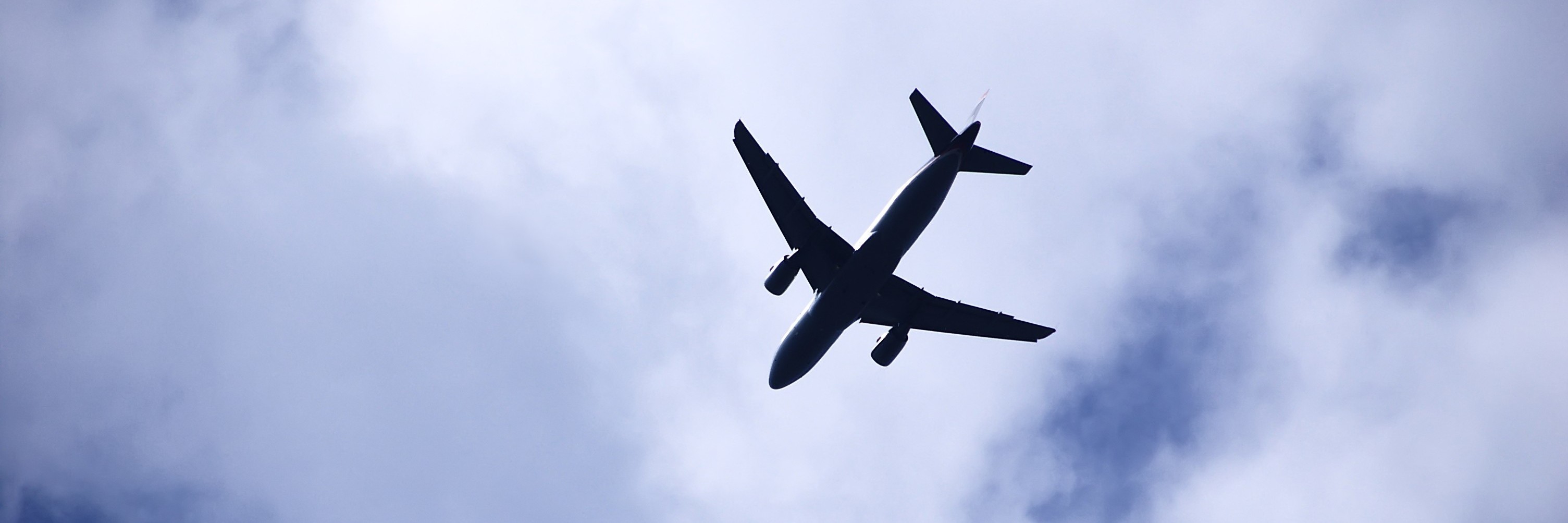 Celiac Disease: Traveling by Airplane When You Are Gluten-Free airplane taking off in the clouds