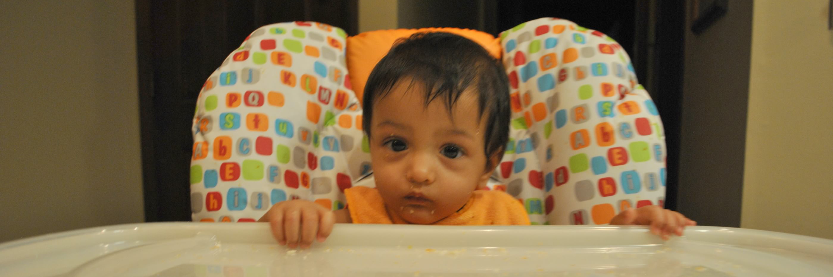 Tips to Help Kids With a 'Failure to Thrive' Diagnosis A little girl with FTT sitting in a high chair