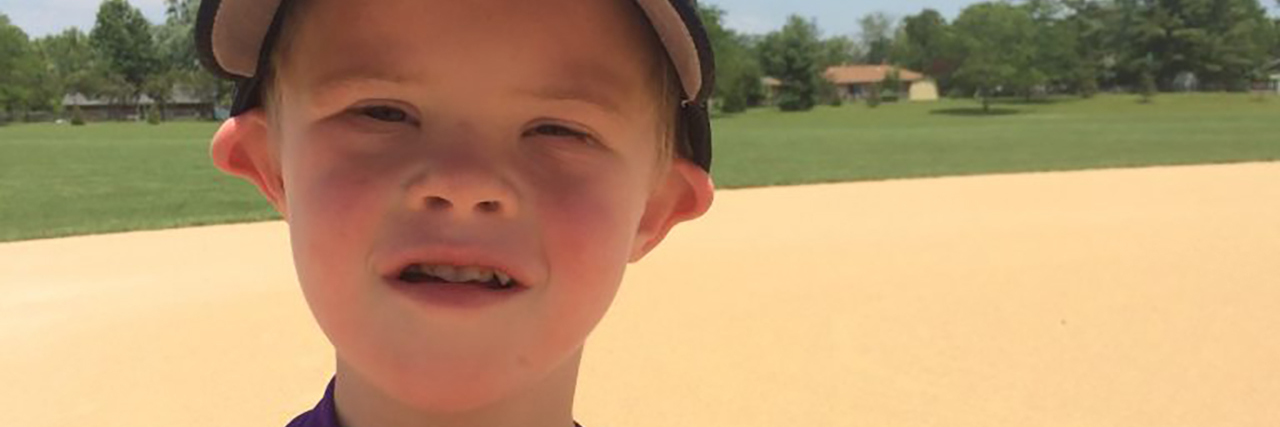 Down Syndrome and Inclusion in Sports Troy on the ballfield.
