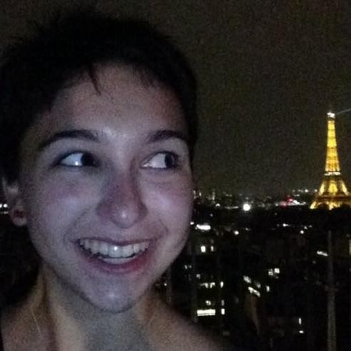 selfie of a woman with the eiffel tower in the background