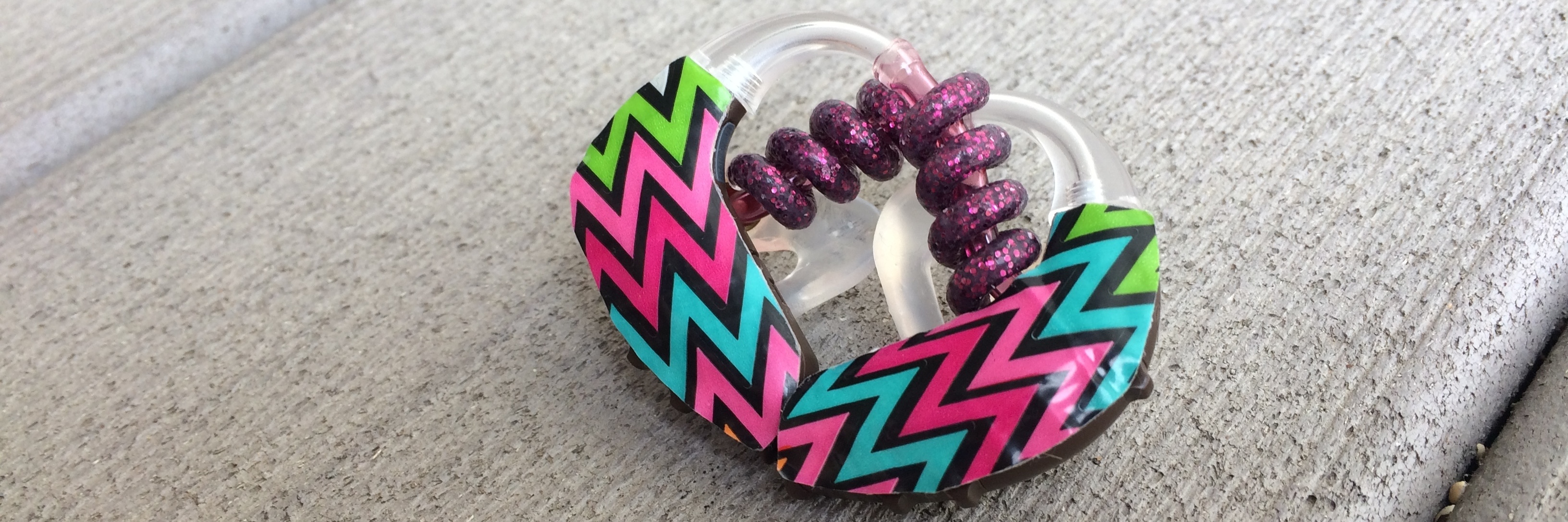 The Day I Decided to Stop Hiding My Hearing Aids Decorated hearing aid.