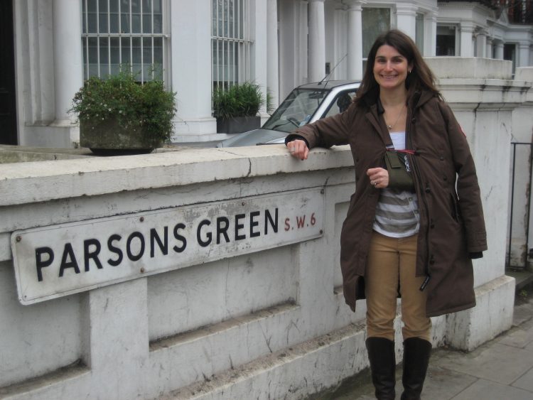 woman standing outside near her home