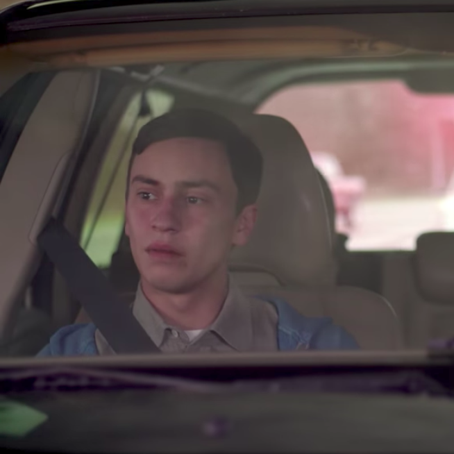 Sam, a teen with autism, in a car with his mother