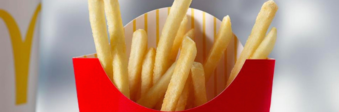 Thank You Letter to McDonald's Employee From Person on Autism Spectrum McDonald's french fries on a table next to a McDonald's beverage cup