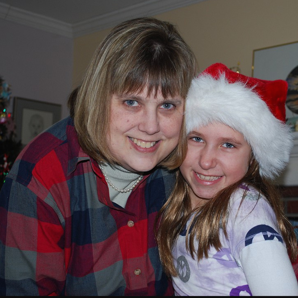 The author with her niece, wearing a Santa hat