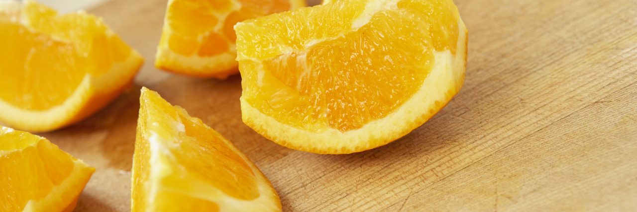 Sliced oranges on cutting board, close up